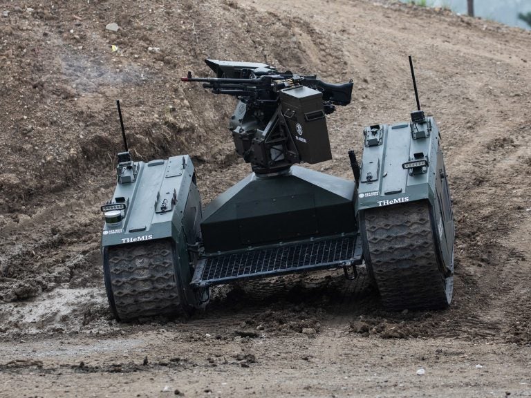 An autonomous tank is demonstrated in France last month. Leading researchers in artificial intelligence are calling for laws against lethal autonomous weapons. They also pledge not to work on such weapons. (Christophe Morin/IP3/Getty Images)
