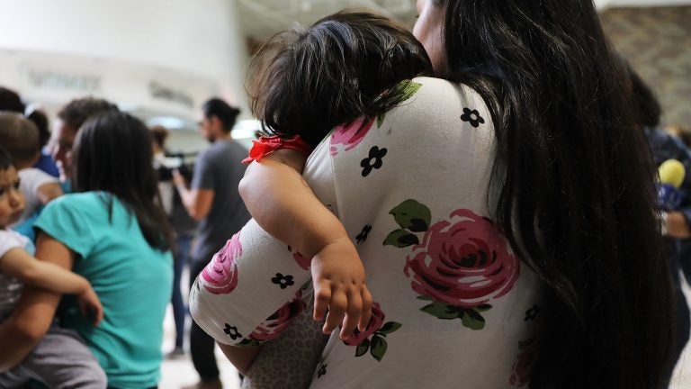 Dozens of migrant women and their children arrive at a bus station in McAllen, Texas, following their release by Customs and Border Protection last month. (Spencer Platt/Getty Images)
