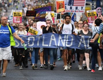 People in Edinburgh, Scotland, march in protest against President Trump during his first official visit to the U.K. People in Edinburgh, Scotland, march in protest against President Trump during his first official visit to the U.K. (Jeff J. Mitchell/Getty Images)