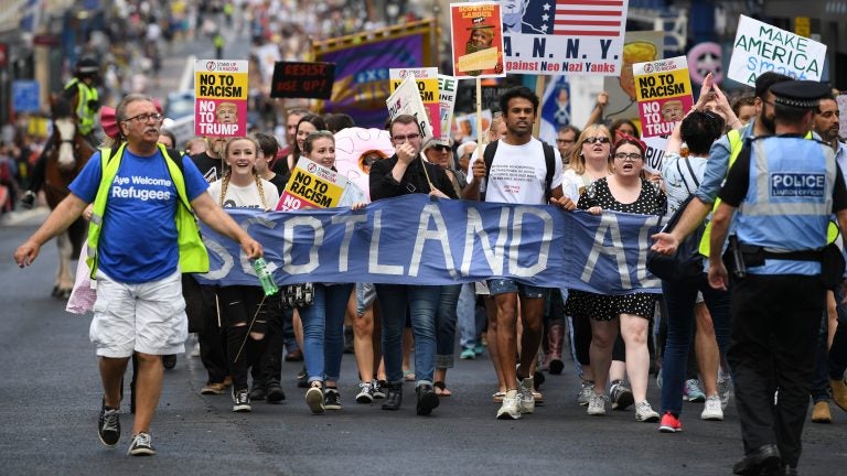 People in Edinburgh, Scotland, march in protest against President Trump during his first official visit to the U.K. (Jeff J. Mitchell/Getty Images)