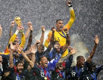 France players lift the World Cup trophy after their victory in the 2018 FIFA World Cup Final between France and Croatia in Moscow on Sunday. (Chris Brunskill/Fantasista/Getty Images)