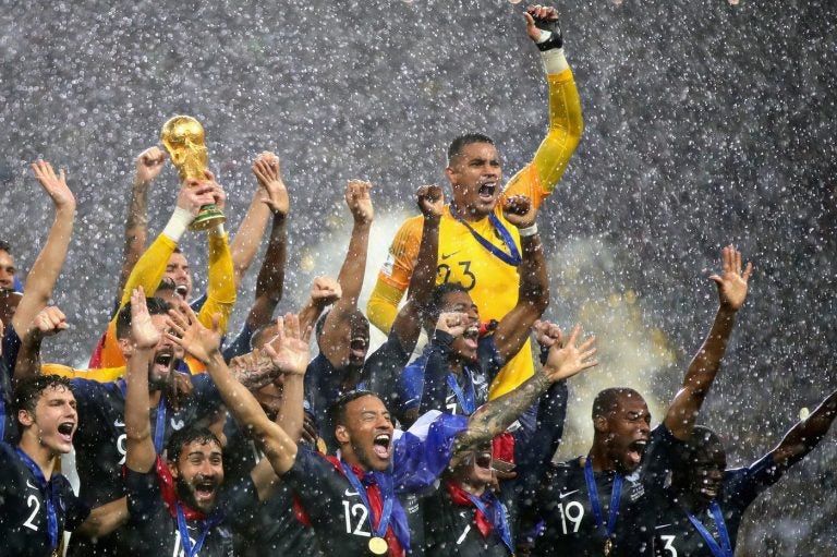 France players lift the World Cup trophy after their victory in the 2018 FIFA World Cup Final between France and Croatia in Moscow on Sunday. (Chris Brunskill/Fantasista/Getty Images)