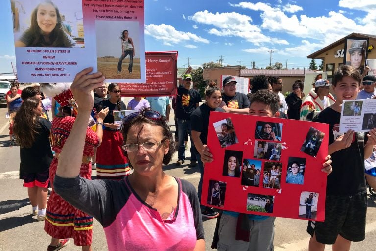 Loxie Loring walks with a group of marchers to remember her daughter, Ashley Loring, who went missing from the Blackfeet Reservation more than a year ago. (Nate Hegyi/Yellowstone Public Radio)
