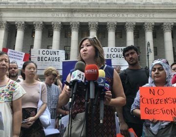 Rep. Grace Meng, D-N.Y. (center) held a press conference earlier this month outside Manhattan federal court with Liz OuYang (left) of the New York Immigration Coalition and other critics of the new citizenship question on the 2020 census. (Hansi Lo Wang/NPR)