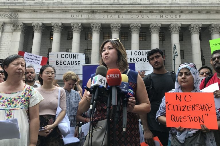 Rep. Grace Meng, D-N.Y. (center) held a press conference earlier this month outside Manhattan federal court with Liz OuYang (left) of the New York Immigration Coalition and other critics of the new citizenship question on the 2020 census. (Hansi Lo Wang/NPR)