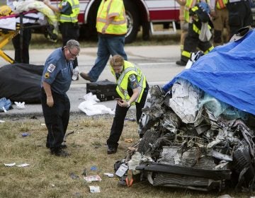 Paramedics work the scene of a deadly car crash on Route 1 near Townsend, Del., Friday, July 6, 2018. (Suchat Pederson/AP)