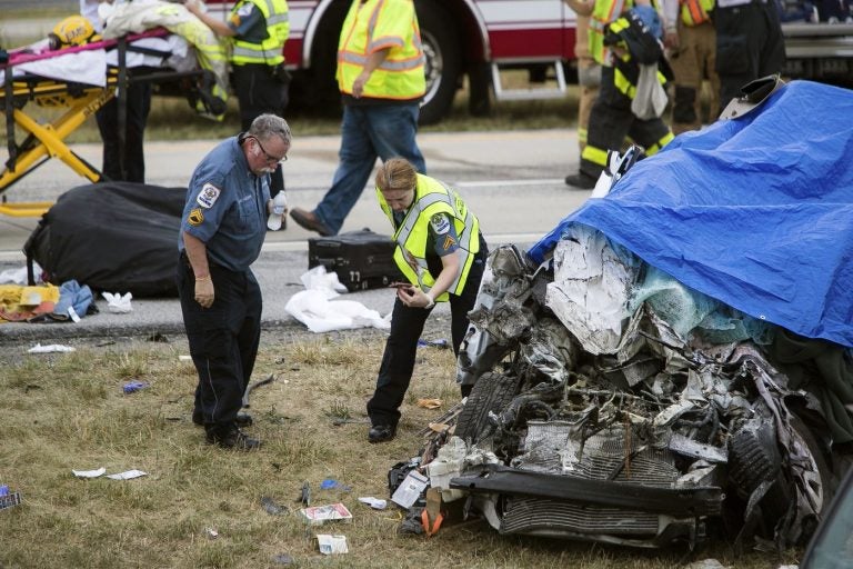 Paramedics work the scene of a deadly car crash on Route 1 near Townsend, Del., Friday, July 6, 2018. (Suchat Pederson/AP)