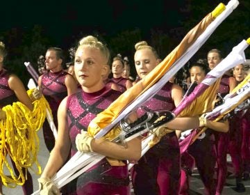 Cadets color guard members move to the field before their first home performance in 2018. (Jessica Griffin, Inquirer/Daily News) 