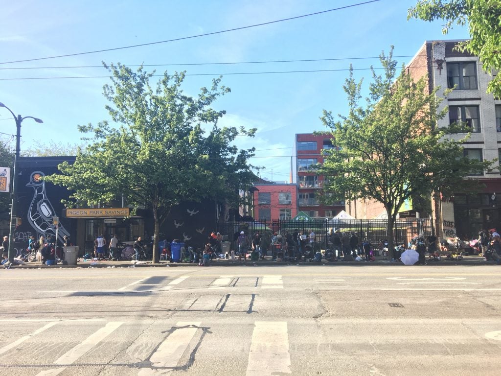 Near Insite, a big outdoor market in an open lot spills out onto on East Hastings street. / Photo by Elana Gordon, WHYY