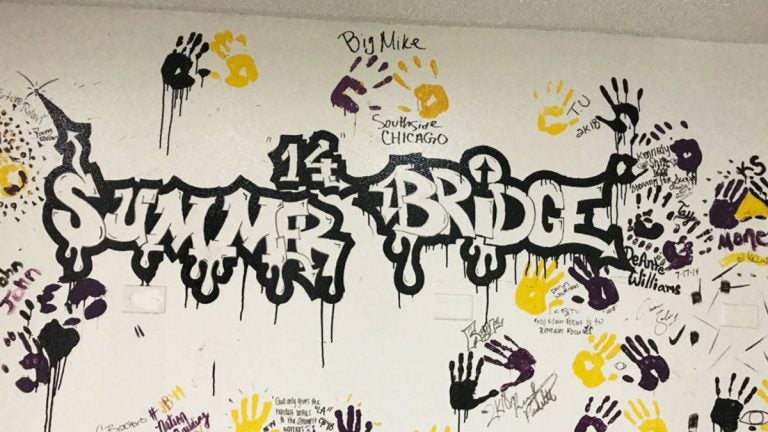 Participants from the college’s Summer Bridge program traditionally leave their mark on campus in the school colors of black, purple and gold. (Delece Smith-Barrow/ The Hechinger Report)