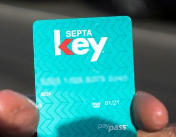 A customer holds up a SEPTA Key card.