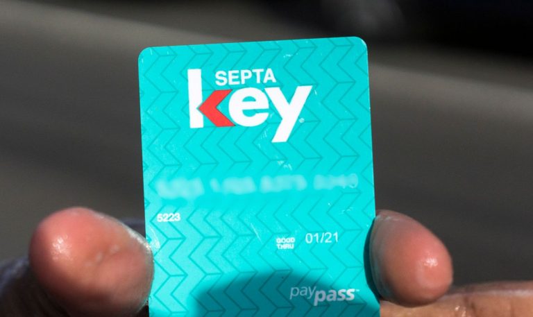 A customer holds up a SEPTA Key card.