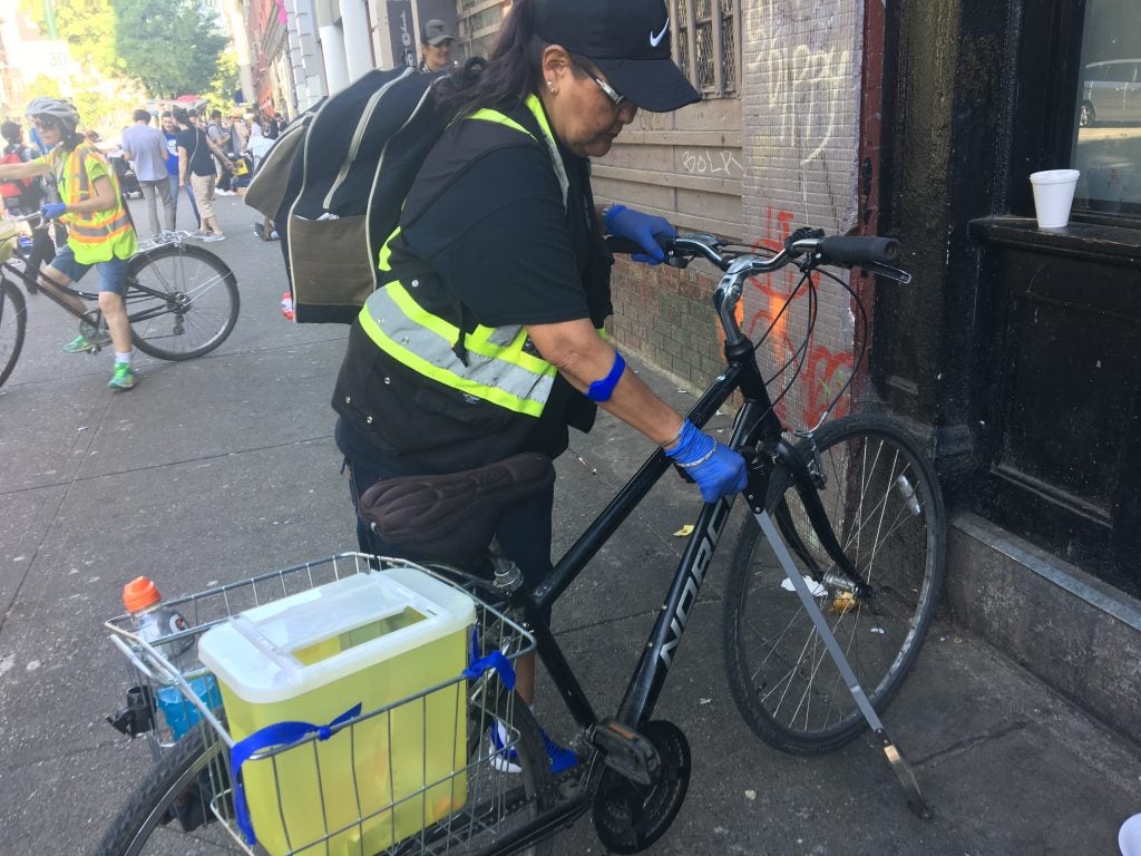 Lana David, right, and Sylvia Poirier, left, respond to overdoses and clean up needles on East Hastings Street and all around the Downtown Eastside as part of the Portland Hotel Society’s Spikes on Bikes initiative. / Photo by Elana Gordon, WHYY