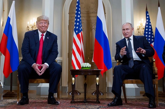 Russian President Vladimir Putin, right, makes a statement as U.S. President Donald Trump, left, looks on at the beginning of a meeting at the Presidential Palace in Helsinki, Finland, Monday, July 16, 2018. (AP Photo/Pablo Martinez Monsivais)