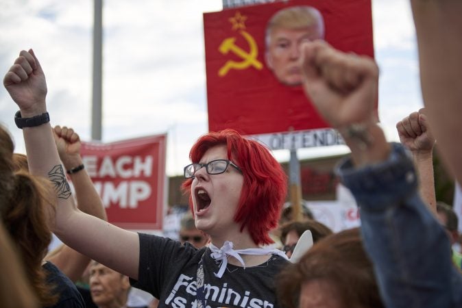 Alexis Yeager, 20, of Dallas, Pa., chants during an Anti-Trump protest outside of the Make America Great Again rally on August 2, 2018 in Wilkes-Barre, Pa. (Natalie Piserchio for WHYY)