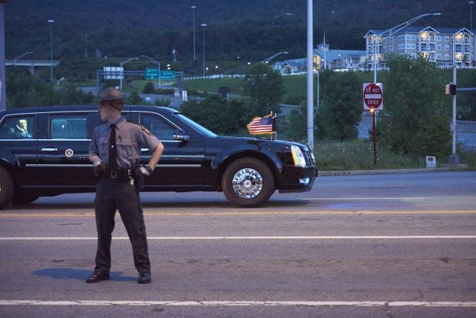 President Donald Trump waves goodbye as his convoy leaves the Make America Great Again rally in Wilkes-Barre on August 2, 2018. (Natalie Piserchio for WHYY)