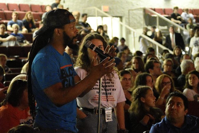 Maj Toure of Black Guns Matter is one of the members from the audience who raised a question for the panel at the end of the Town Hall on Gun Control at  Universal Audenried Charter High School, one Tuesday. (Bastiaan Slabbers for WHYY)