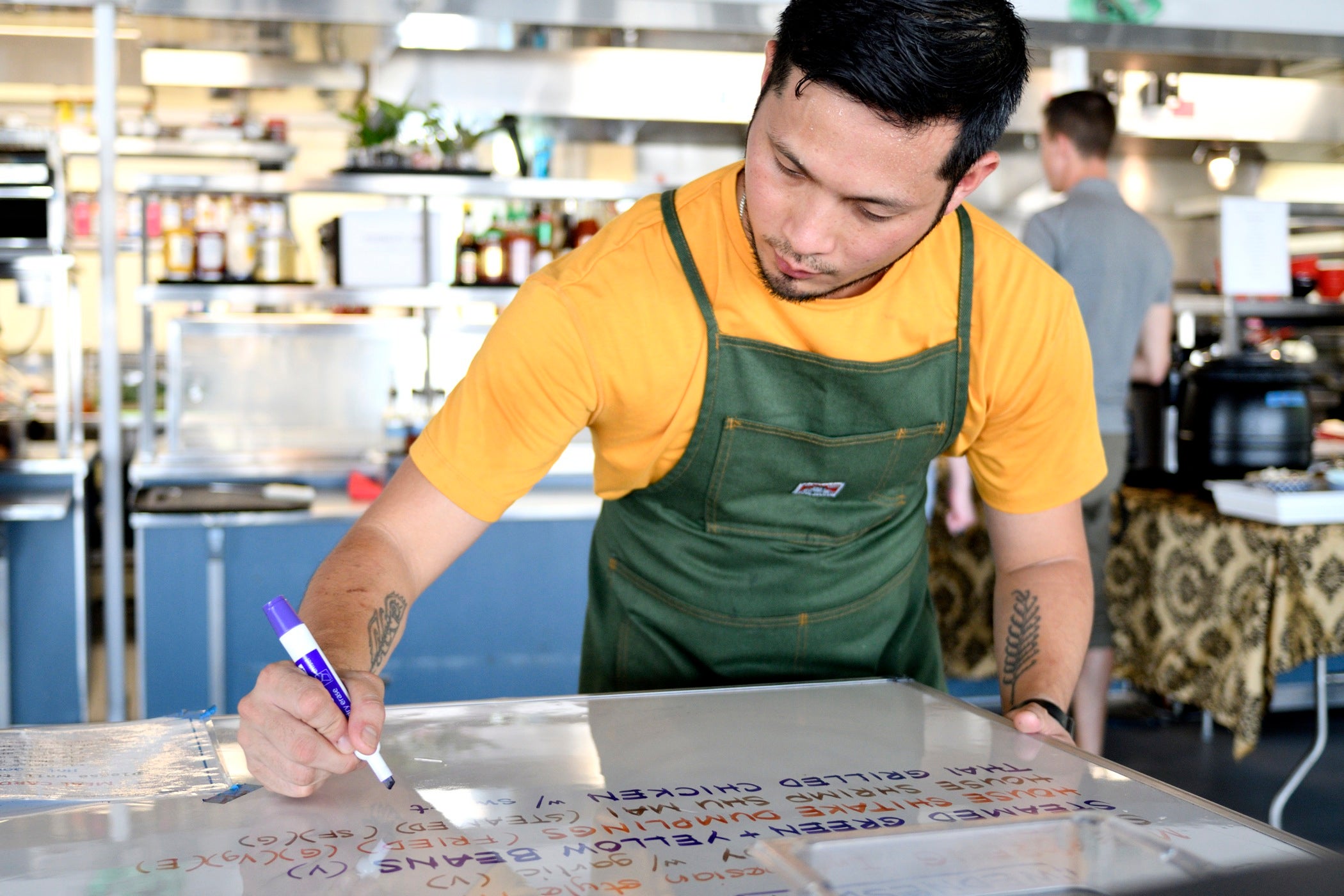 Kitchen Manager Ariel Layug prepares the menu of the day, at the kitchen of Cirque Du Soleil's VOLTA, in OAKS, PA, on August 8, 2018.