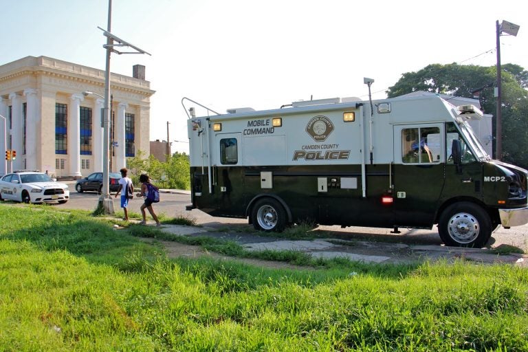 The Camden County Police mobile command sets up on Broadway near Mount Vernon Street in Camden, where two detectives were shot. (Emma Lee/WHYY)