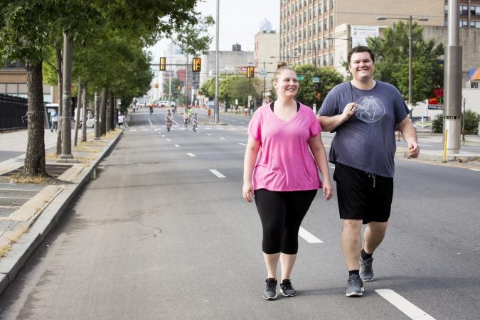 Lynne Silverstein (left) and Peter Zoltowski go for a walk down Broad Street on August 11, 2018. Silverstein says 