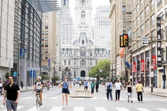 Pedestrians enjoy Philly Free Streets, a program in its third year, which closed down Broad Street to cars from City Hall to Germantown Avenue for the morning and afternoon of August 11, 2018. (Rachel Wisniewski for WHYY)