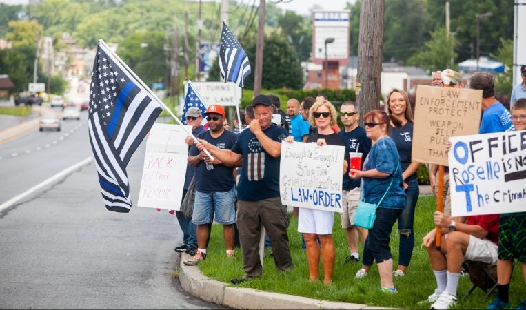 Supporters of South Whitehall Township Police Officer Jonathan Roselle gathered on Hamilton Boulevard where he fatally shot Joseph Santos, 44, of Hasbrouck Heights, N.J. on July 28, 2018. (Brad Larrison for WHYY)