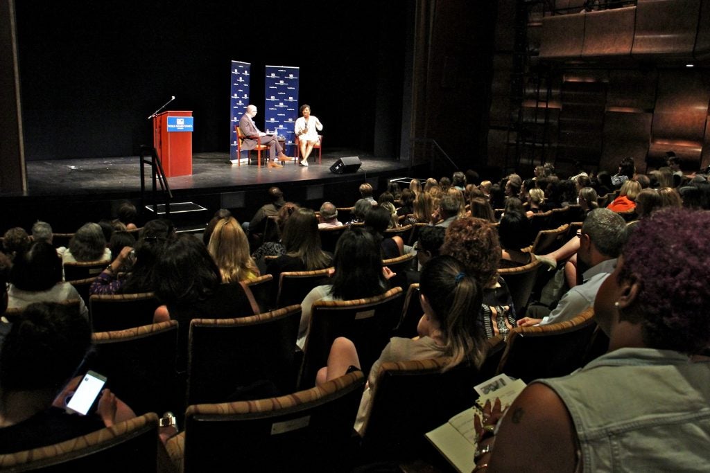 An audience fills the Suzanne Roberts Theater to hear the story of Tarana Burke, founder of the #MeToo movement. 