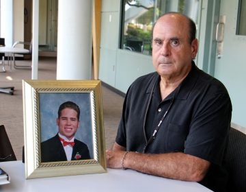 Arthur Baselice Jr. poses with a photo of his son, Arthur Baselice III, who was abused by two Franciscan clergymen in Northeast Philadelphia. Baselice III died of a drug overdose in 2006 at age 28.