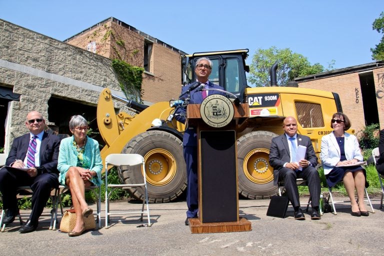 Kris Kolluri, president and CEO of Coopers Ferry Partnership, announces plans to clean up the trash-strewn Camden Labs property and turn it into a park.