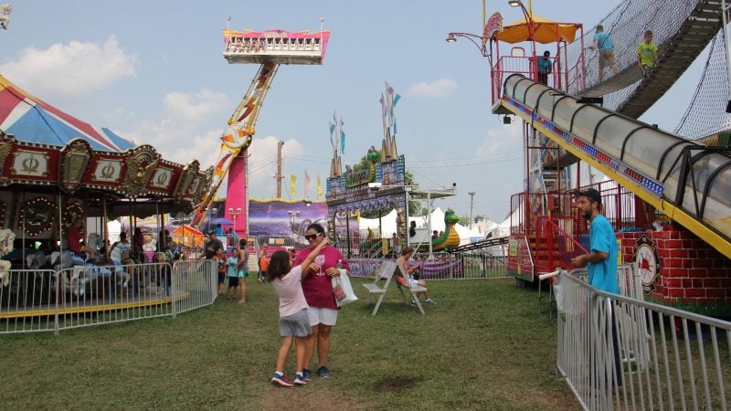 Visitors to the Middletown Grange Fair can visit the rides and food tents. (Emma Lee/WHYY)