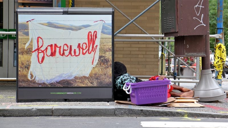 A silk graffiti work by Aubrie Costello adorns a trash can at 18th and Walnut streets. (Emma Lee/WHYY)