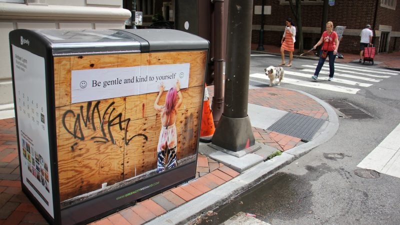 Amber Lynn's artwork graces a Bigbelly trash can at 17th and Locust streets. (Emma Lee/WHYY)