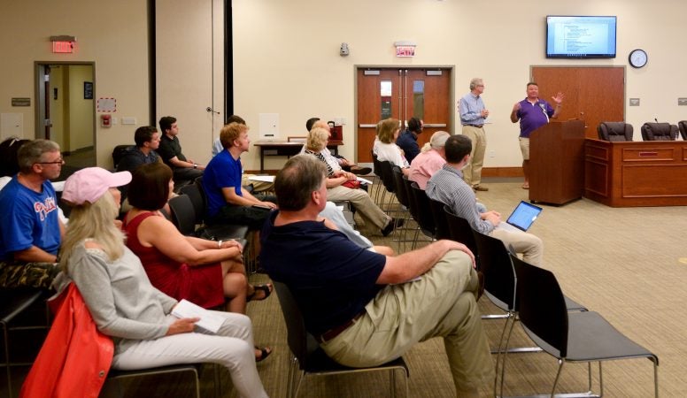 Consultant Thomas Frawley and developer Manny DeMutis present plans for the extension of rail commuter service from Philadelphia to Phoenixville, at a borough meeting in Phoenixville, PA, on August 21, 2018. (Bastiaan Slabbers for WHYY)