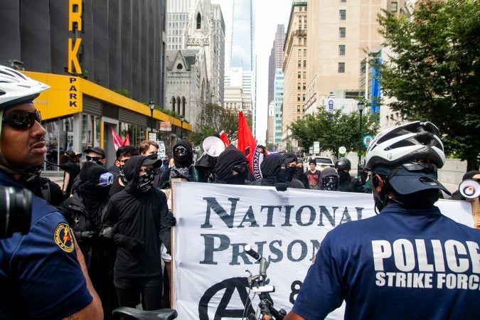 Protestors were blocked by police on Arch Street as they attempted to intercept a Blue Lives Matter march  on Saturday. (Brad Larrison for WHYY)