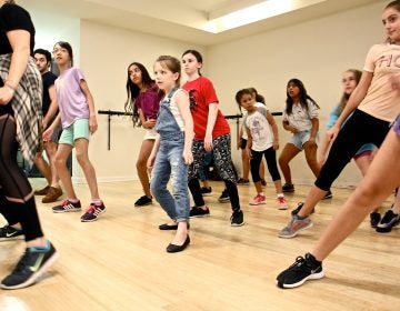 Young students work on a dance number during Hamilton Camp at Music Theatre Philly.