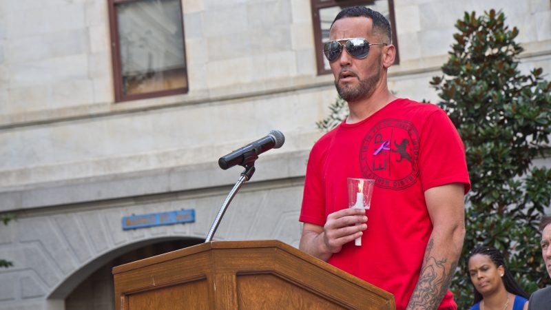 Richard Sheaffer remembers his sister Linda Rios at a candlelight vigil at City Hall courtyard Thursday afternoon. Kimberly Paynter/WHYY)