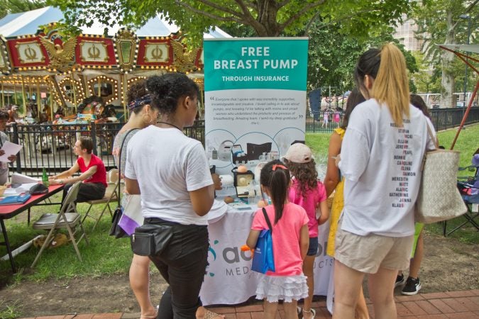 The Big Latch breastfeeding event at Franklin Square Park in Philadelphia offered resources to mothers. (Kimberly Paynter/WHYY)