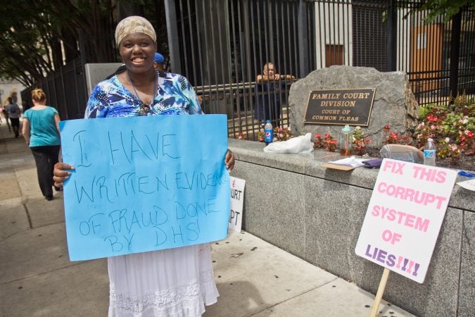 Antoinette Richardson protests outside Family Court Friday. She’s been separated from her children for three years. (Kimberly Paynter/WHYY)