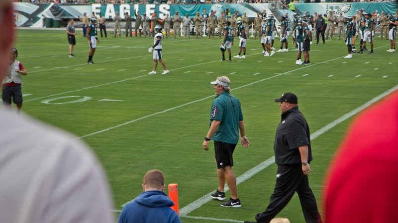 Eagles head coach Dough Pederson takes the field during the team's first open practice of the season. (Kimberly Paynter/WHYY)