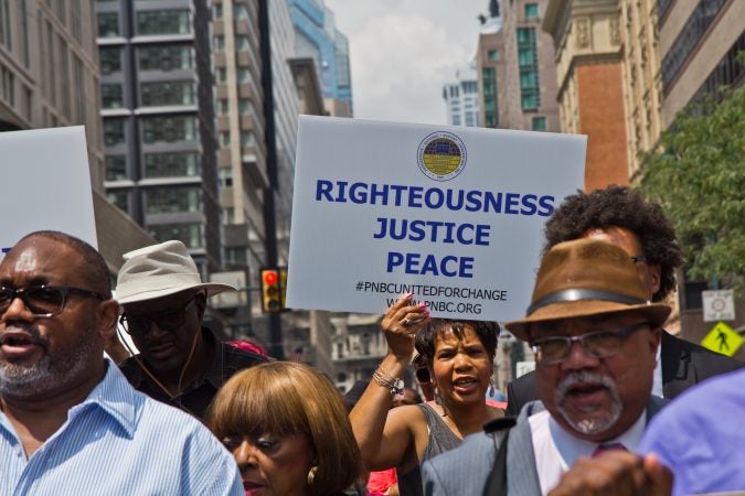 Members of the Progressive National Baptist Convention march for justice on Market Street in Philadelphia. (Kimberly Paynter/WHYY)