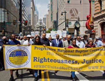 Members of the Progressive National Baptist Convention march for justice on Market Street in Philadelphia. (Kimberly Paynter/WHYY)