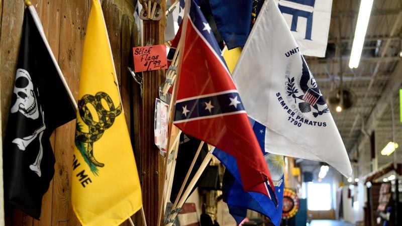 Stick flags are sold from a booth at Zern's Farmers Market in Gilbertsville, Pa. (Bastiaan Slabbers for WHYY)