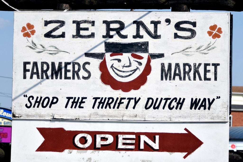"Shop the thrifty Dutch way," reads a sign welcoming visitors to Zern's Farmers Market in Gillberstville, Pa.