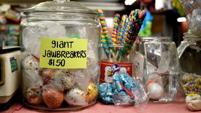 A jar of giant jawbreakers dominates the counter at the candy store, a popular stall at Zern's Farmers Market in Gilbertsville, Pa. (Bastiaan Slabbers for WHYY)