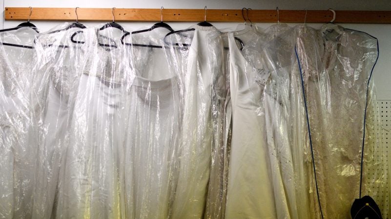 Wedding dresses are sold from a stall at Zern's Farmers Market in Gilbertsville, Pa. (Bastiaan Slabbers for WHYY)