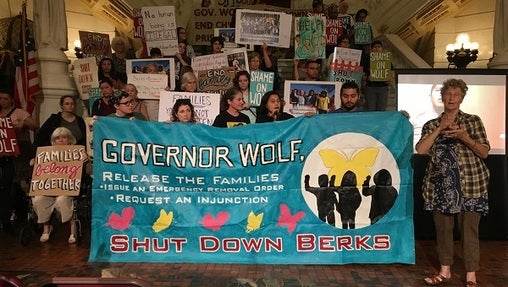 Protesters gathered in the Capitol to call on Wolf for further action. (Katie Meyer/WITF)