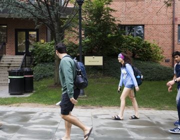 Incoming freshmen at the University of Scranton walk past McCormick Hall, one of three campus buildings that will soon be renamed in response to the recent report on Pennsylvania priest abuse.
(Rachel Wisniewski)