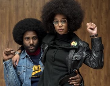 Ron (John David Washington) and Patrice (Laura Harrier) strike power poses in Spike Lee's BlacKkKlansman.
(David Lee/Focus Features)