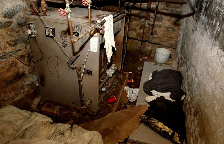 The dank basement room in Philadelphia where four weak and malnourished mentally disabled adults, one chained to the boiler, were found locked inside on Saturday is shown Monday, Oct. 17, 2011. Police arrested three adults staying in an apartment upstairs, including the person accused of being the ringleader, Linda Ann Weston, in what authorities say is a scheme to steal the Social Security disability checks of defenseless and vulnerable people. (Ron Cortes/AP Photo, Pool)