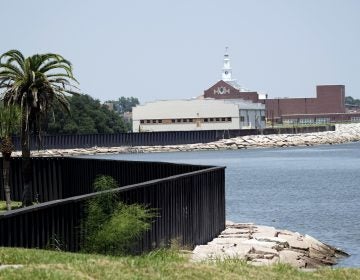 A seawall, which will be increased in size, is shown along the banks near downtown Thursday, July 26, 2018, in Port Arthur, Texas.  The oil industry wants the government to help protect some of its facilities on the Texas Gulf Coast against the effects of global warming. One proposal involves building a nearly 60-mile “spine” of flood barriers to shield refineries and chemical plants. Many Republicans argue that such projects should be a national priority. But others question whether taxpayers should have to protect refineries in a state where top politicians still dispute whether climate change is real. (David J. Phillip/AP Photo)